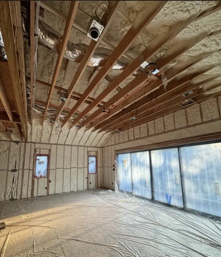 Interior walls and ceiling insulated with spray foam during new construction in Van Alstyne